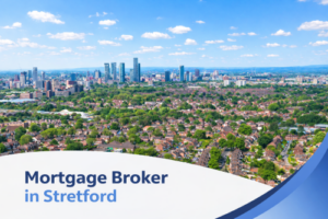 A bright summer aerial view of Stretford with rows of red-brick suburban houses surrounded by green trees, with the Manchester skyline in the distance under a blue sky with scattered clouds. A curved white and blue graphic banner at the bottom displays the text “Mortgage Broker in Stretford”.