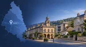 Mortgage Broker in Hexham hero image showing a Northumberland location map with a Hexham marker, alongside a street scene with mixed property types and a local landmark.